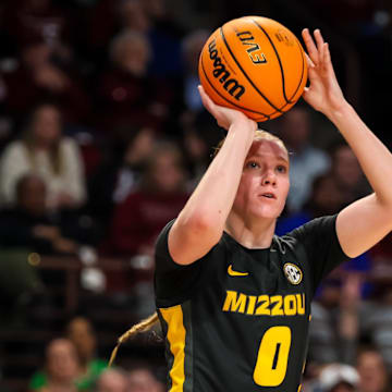 Feb 8, 2024; Columbia, South Carolina, USA; Missouri Tigers guard Grace Slaughter (0) attempts a three point basket against the South Carolina Gamecocks in the second half at Colonial Life Arena. Mandatory Credit: Jeff Blake-Imagn Images