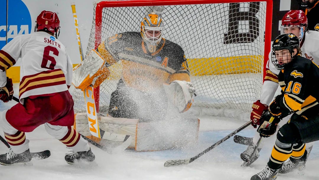 Will Smith 6 in front of the net, Isaac Gordon, 16, defends for Michigan Tech. Blake Pietila in net. Will Smith 6 in front of the net, Isaac Gordon, 16, defends for Michigan Tech. Blake Pietila in net.