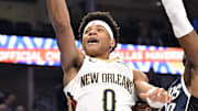 Nov 21, 2025; Dallas, Texas, USA; New Orleans Pelicans guard Jeremiah Fears (0) drives to the basket past Dallas Mavericks guard Brandon Williams (10) during the first quarter at the American Airlines Center. Mandatory Credit: Jerome Miron-Imagn Images