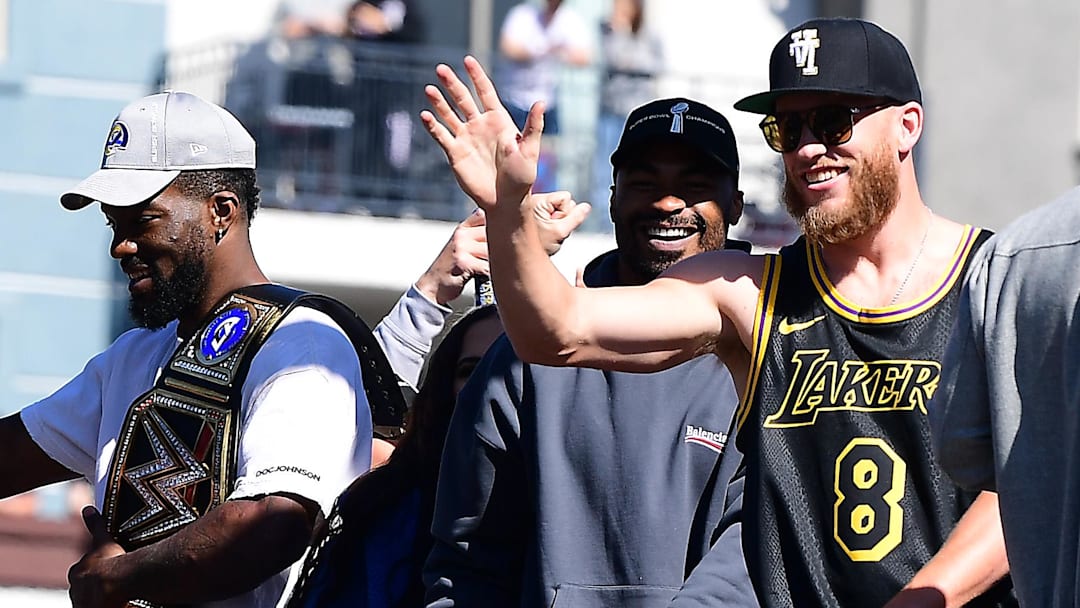 Feb 16, 2022; Los Angeles, CA, USA; Los Angeles Rams wide receiver Cooper Kupp wide receiver Robert Woods and outside linebacker Leonard Floyd celebrate during the Los Angeles Rams Championship Parade. Mandatory Credit: Gary A. Vasquez-Imagn Images