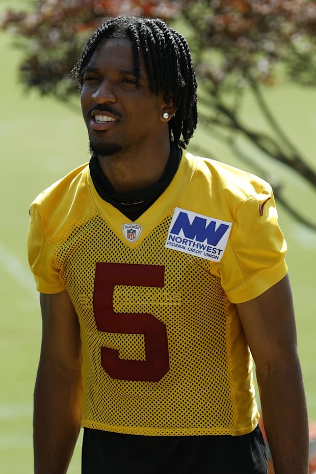 Washington Commanders quarterback Jayden Daniels leaves the practice field on day two of training camp