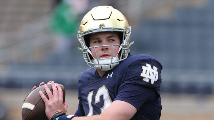 Notre Dame quarterback Riley Leonard (13) who is hurt, dresses and throws some pre-game passes with fellow quarterbacks Saturday, April 20, 2024, at the annual Notre Dame Blue-Gold spring football game at Notre Dame Stadium in South Bend.