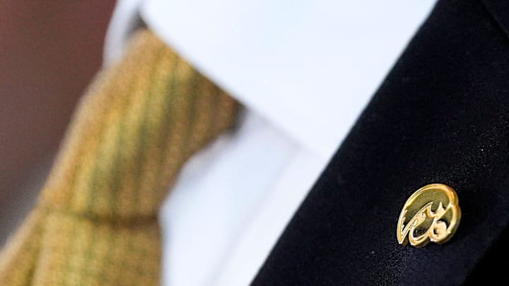 Ben McCollum wears a Hawkeye pin during a press conference introducing him as Iowa's new head men's basketball coach Tuesday, March 25, 2025 at Carver-Hawkeye Arena in Iowa City, Iowa.