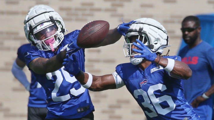 Bills defensive backs Daequan Hardy, left, and Kendall Williamson battle for possession of the ball during drills on day three of the Buffalo Bills training camp at St. John Fisher University in Pittsford, Friday, July 26, 2024.