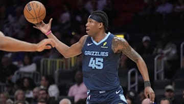 Oct 17, 2025; Miami, Florida, USA;  Memphis Grizzlies forward Gg Jackson (45) catches a pass as Miami Heat forward Keshad Johnson (16) defends during the second half at Kaseya Center. Mandatory Credit: Jim Rassol-Imagn Images