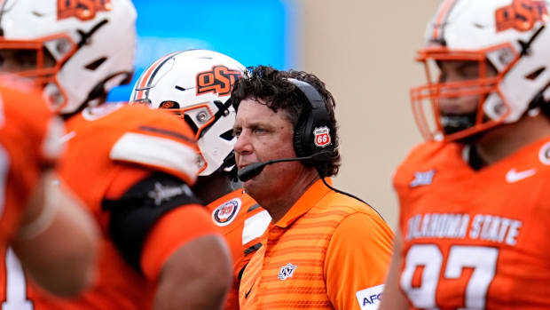 Oklahoma State Cowboys coach Mike Gundy waits for a call in the second half against the South Dakota State Jackrabbits.