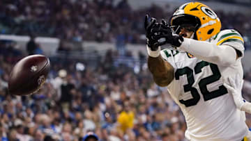 Green Bay Packers running back MarShawn Lloyd (32) and Indianapolis Colts cornerback Chris Lammons (38) miss a long pass on Saturday, Aug. 16, 2025, during a game against the Green Bay Packers at Lucas Oil Stadium in Indianapolis.