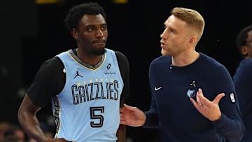 Mar 31, 2025; Memphis, Tennessee, USA; Memphis Grizzlies interim head coach Tuomas Iisalo (right) talks with Memphis Grizzlies guard Vince Williams Jr. (5) during the first quarter at FedExForum. Mandatory Credit: Petre Thomas-Imagn Images