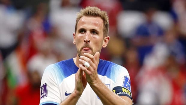 England forward Harry Kane acknowledges fans after a group stage match against the United States of America.