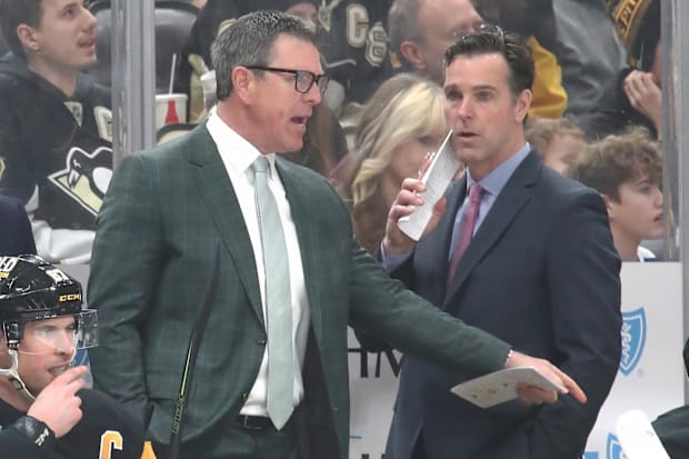 Hockey coaches talk on the benc