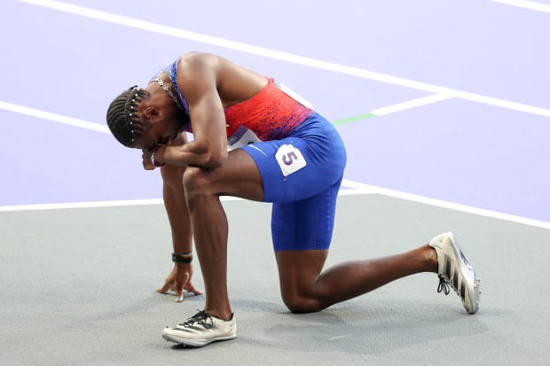 Lyles had to be taken out of the stadium on a wheelchair after the race.