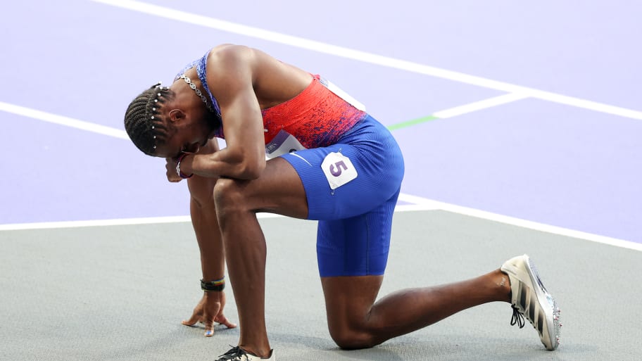 Lyles had to be taken out of the stadium on a wheelchair after the race.