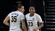 Vanderbilt's Sacha Washington (35) and Iyana Moore (23) celebrate near the end of the game against Georgia in an NCAA college basketball game Sunday, March 3, 2024, in Nashville, Tenn. Vanderbilt won 72-55.