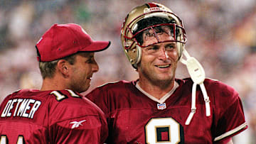 San Francisco 49ers quarterback Steve Young (R) ta