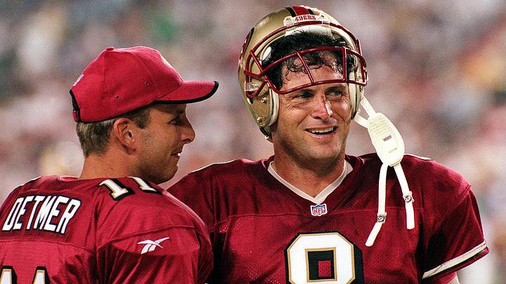 San Francisco 49ers quarterback Steve Young (R) ta