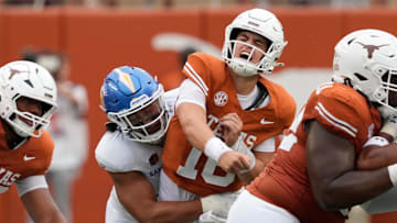 Sep 6, 2025; Austin, Texas, USA; Texas Longhorns quarterback Arch Manning (16) reacts after getting hit by San Jose State Spartans linebacker Taniela Latu (4).