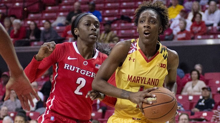 Feb 10, 2015; College Park, MD, USA; Maryland Terrapins guard Laurin Mincy (1) makes a move to the basket past Rutgers Scarlet Knights guard/forward Kahleah Copper (2) during the second half at Xfinity Center. Maryland Terrapins defeated Rutgers Scarlet Knights 80-69. Mandatory Credit: Tommy Gilligan-Imagn Images