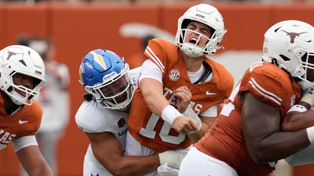 Texas Longhorns quarterback Arch Manning (16) and San Jose State Spartans linebacker Taniela Latu (4).