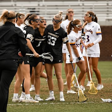 Vanderbilt lacrosse players celebrate.