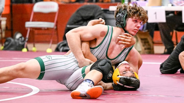 El Diamante's Chris Creason (top) and Golden West's David Lopez compete in the boys 157-pound EYL league championship at Mt. Whitney High School on Wednesday, February 5, 2025. El Diamante's Chris Creason (top) and Golden West's David Lopez compete in the boys 157-pound EYL league championship at Mt. Whitney High School on Wednesday, February 5, 2025.