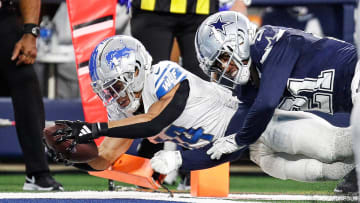 Lions wide receiver Amon-Ra St. Brown scores a touchdown against Cowboys cornerback Stephon Gilmore during the second half of the Lions' 20-19 loss at AT&T Stadium in Arlington, Texas on Saturday, Dec. 30, 2023.