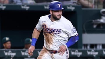 Apr 29, 2025; Arlington, Texas, USA; Texas Rangers first base Jake Burger (21) scores a run during the third inning against the Oakland Athletics at Globe Life Field.