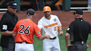 Tennessee Volunteers head coach Tony Vitello and Virginia Cavaliers head coach Brian O'Connor meet before the game at TD Ameritrade Park.