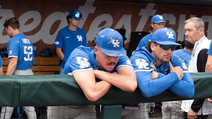 Jun 19, 2024; Omaha, NE, USA;  Kentucky Wildcats pitcher Cameron O'Brien (10) and first baseman Ryan Nicholson (25) look over the field after the loss against the Florida Gators at Charles Schwab Field Omaha. Mandatory Credit: Steven Branscombe-Imagn Images