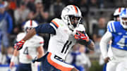 Nov 15, 2025; Durham, North Carolina, USA;  Virginia Cavaliers wide receiver Trell Harris (11) runs the ball during the third quarter against the Duke Blue Devils at Wallace Wade Stadium. Mandatory Credit: Zachary Taft-Imagn Images