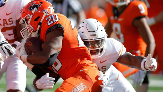 Texas Longhorns linebacker Jaylan Ford (41) makes a run stop against the Oklahoma State Cowboys 
