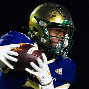 Knoxville Catholic's Tyreek King (7) catches the ball during a football game at Knoxville Catholic on Friday, Nov. 3, 2023.