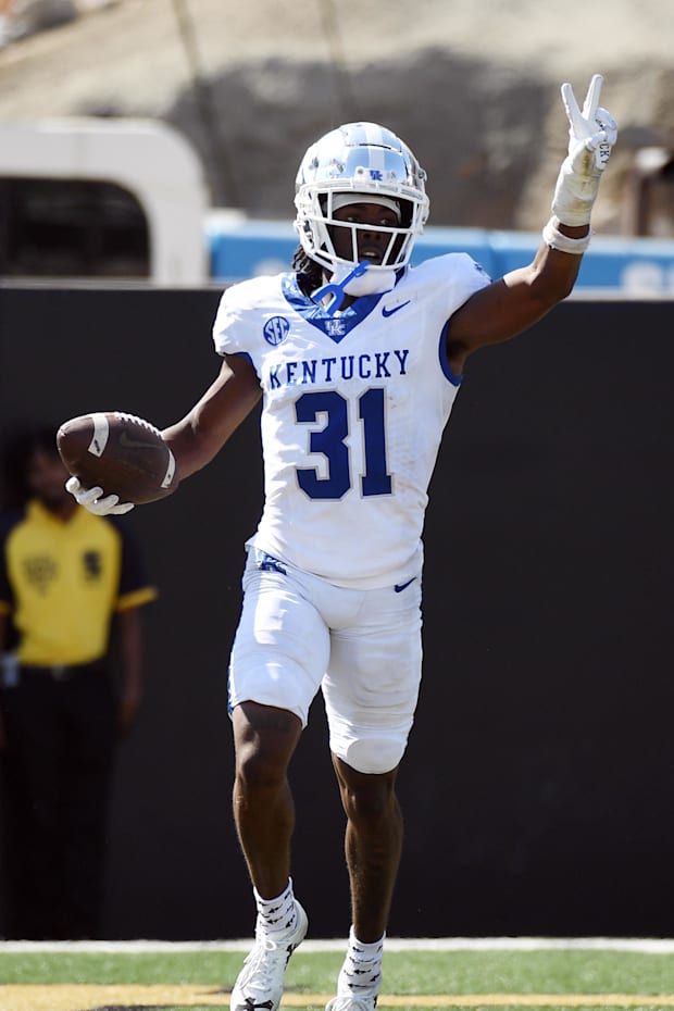 Kentucky Wildcats defensive back Maxwell Hairston celebrates after after scoring his second touchdown