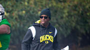 New co-defensive coordinator and safeties coach Chris Hampton, right, joins the first practice of spring for Oregon football as they prepare for the 2023 season.