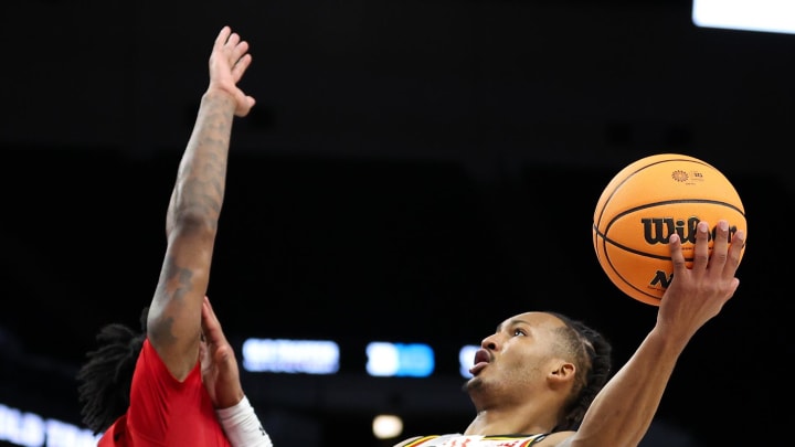 Mar 13, 2024; Minneapolis, MN, USA; Maryland Terrapins guard Jahmir Young (1) shoots as Rutgers Scarlet Knights guard Jeremiah Williams (25) defends during the second half at Target Center. Mandatory Credit: Matt Krohn-USA TODAY Sports