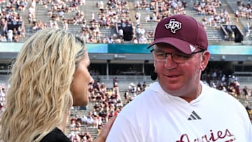 Oct 5, 2024; College Station, Texas, USA; SEC Nation host Laura speaks with Texas A&M Aggies head coach Mike Elko prior to the game between the Texas A&M Aggies and the Missouri Tigers at Kyle Field. Mandatory Credit: Maria Lysaker-Imagn Images. 