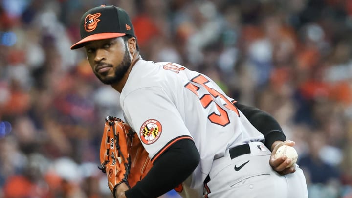 Jun 23, 2024; Houston, Texas, USA; Baltimore Orioles relief pitcher Dillon Tate (55) checks the runner at first base against the Houston Astros in the sixth inning at Minute Maid Park