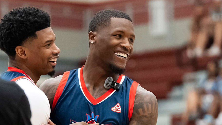 Cincinnati Bengals wide receiver Tee Higgins, right, jokes around with EJ Bush during the Tee+Jaden+BMaze Celebrity Basketball Game at Oak Ridge High School's Wildcat Arena on June 20, 2025. | Brianna Paciorka/News Sentinel / USA TODAY NETWORK via Imagn Images