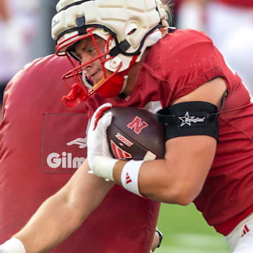 Nebraska tight end Carter Nelson runs through a block during a drill at the Big Red Preview on Saturday.