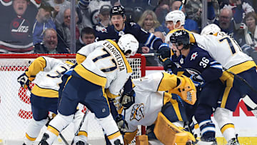 Jan 7, 2025; Winnipeg, Manitoba, CAN; Winnipeg Jets center Morgan Barron (36) celebrates his first period goal on Nashville Predators goaltender Juuse Saros (74) at Canada Life Centre. Mandatory Credit: James Carey Lauder-Imagn Images