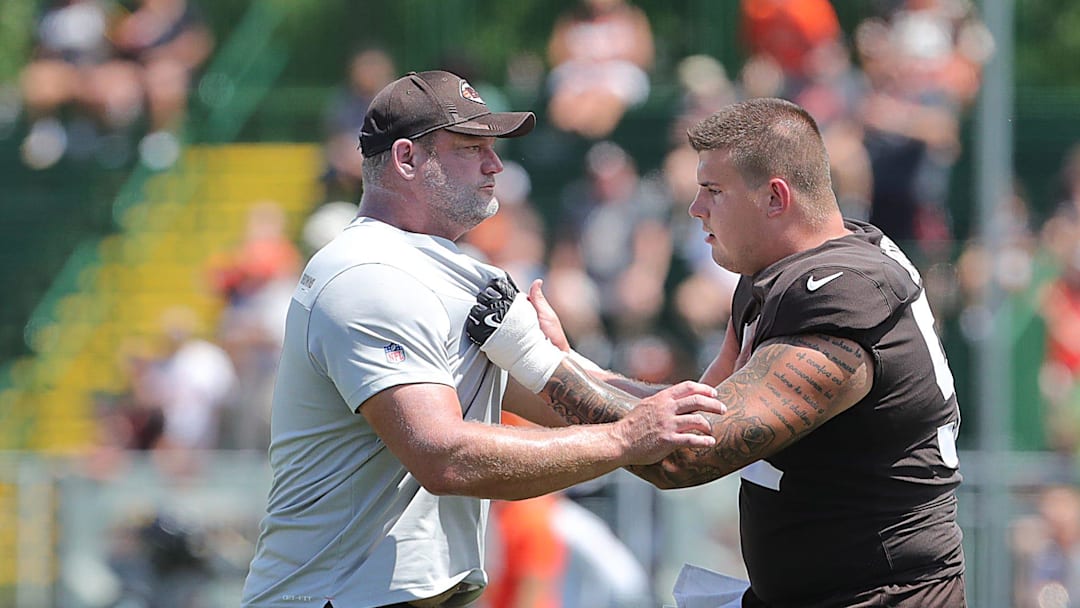 Cleveland Browns assistant offensive line coach Scott Peters works with center Ethan Pocic during training camp on Friday, Aug. 5, 2022 in Berea. Cleveland Browns assistant offensive line coach Scott Peters works with center Ethan Pocic during training camp on Friday, Aug. 5, 2022 in Berea.