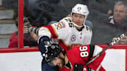 Mar 28, 2019; Ottawa, Ontario, CAN; Florida Panthers defenseman Brady Keeper (25) checks Ottawa Senators defenseman Christian Wolanin (86) in the third period at the Canadian Tire Centre. Mandatory Credit: Marc DesRosiers-Imagn Images
