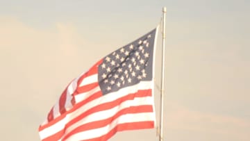 The American Flag flies high over Ben Desaulnier Field during the American Legion baseball game between Danielson Post 21 and Waterford Post 161 at Owen Bell Park in Dayville.