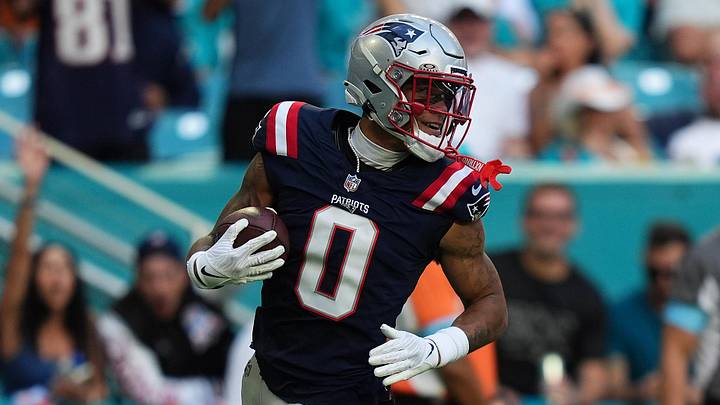 Nov 24, 2024; Miami Gardens, Florida, USA; New England Patriots cornerback Christian Gonzalez (0) runs the ball for a touchdown after recovering a fumble against the Miami Dolphins during the second half at Hard Rock Stadium. Mandatory Credit: Jasen Vinlove-Imagn Images