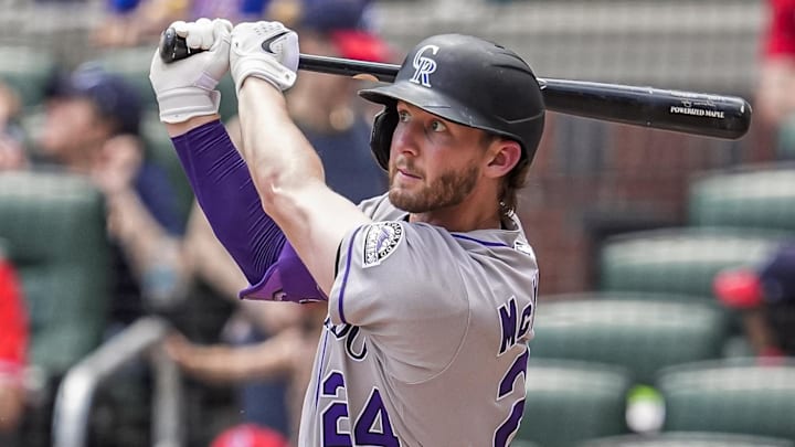 Jun 15, 2025; Cumberland, Georgia, USA; Colorado Rockies third baseman Ryan McMahon (24) hits a home run against the Atlanta Braves during the seventh inning at Truist Park. Jun 15, 2025; Cumberland, Georgia, USA; Colorado Rockies third baseman Ryan McMahon (24) hits a home run against the Atlanta Braves during the seventh inning at Truist Park.