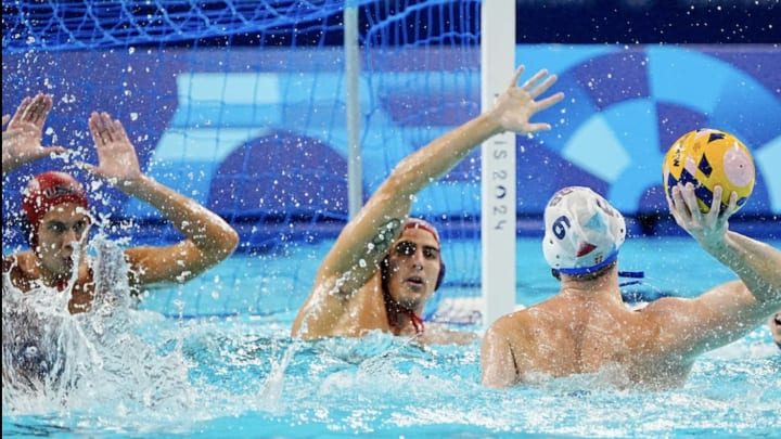 USA goaltender Adrian Weinberg prepares for a Serbian shot