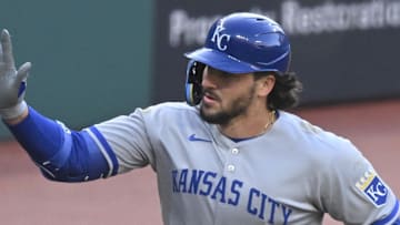Kansas City Royals designated hitter Vinnie Pasquantino (9) celebrates his solo home run with third base coach Vance Wilson (25) in the fourth inning against the Cleveland Guardians.