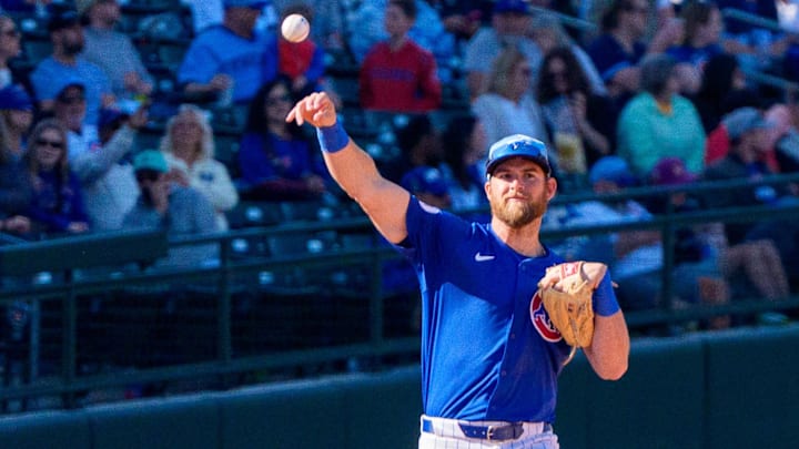 Mar 8, 2025; Mesa, Arizona, USA; Chicago Cubs infielder Gage Workman (25) throws around between out during the seventh inning of a spring training game against the Seattle Mariners at Sloan Park. Mar 8, 2025; Mesa, Arizona, USA; Chicago Cubs infielder Gage Workman (25) throws around between out during the seventh inning of a spring training game against the Seattle Mariners at Sloan Park.