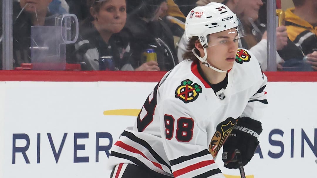 Apr 8, 2025; Pittsburgh, Pennsylvania, USA;  Chicago Blackhawks center Connor Bedard (98) skates with the puck against the Pittsburgh Penguins during the first period at PPG Paints Arena. Mandatory Credit: Charles LeClaire-Imagn Images