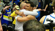Barlow coach Tom Johnson and senior guard Jalen Atkins hug after the Bruins won the OSAA Class 6A boys basketball state championship Saturday night.