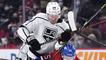 Nov 9, 2021; Montreal, Quebec, CAN; Los Angeles Kings forward Arthur Kaliyev (34) checks Montreal Canadiens forward Michael Pezetta (55) during the first period at the Bell Centre. Mandatory Credit: Eric Bolte-USA TODAY Sports